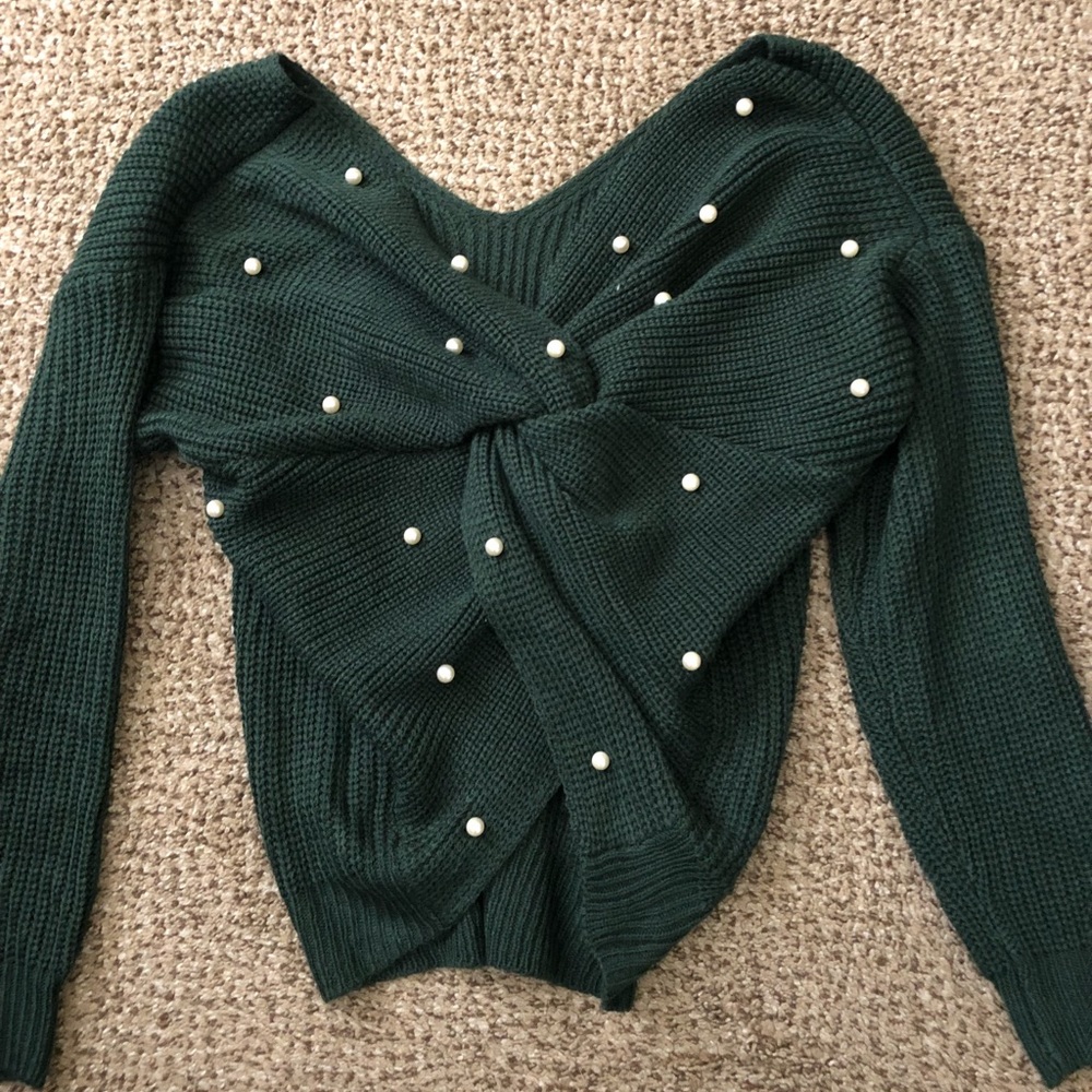 Green sassy sweater with white beading.